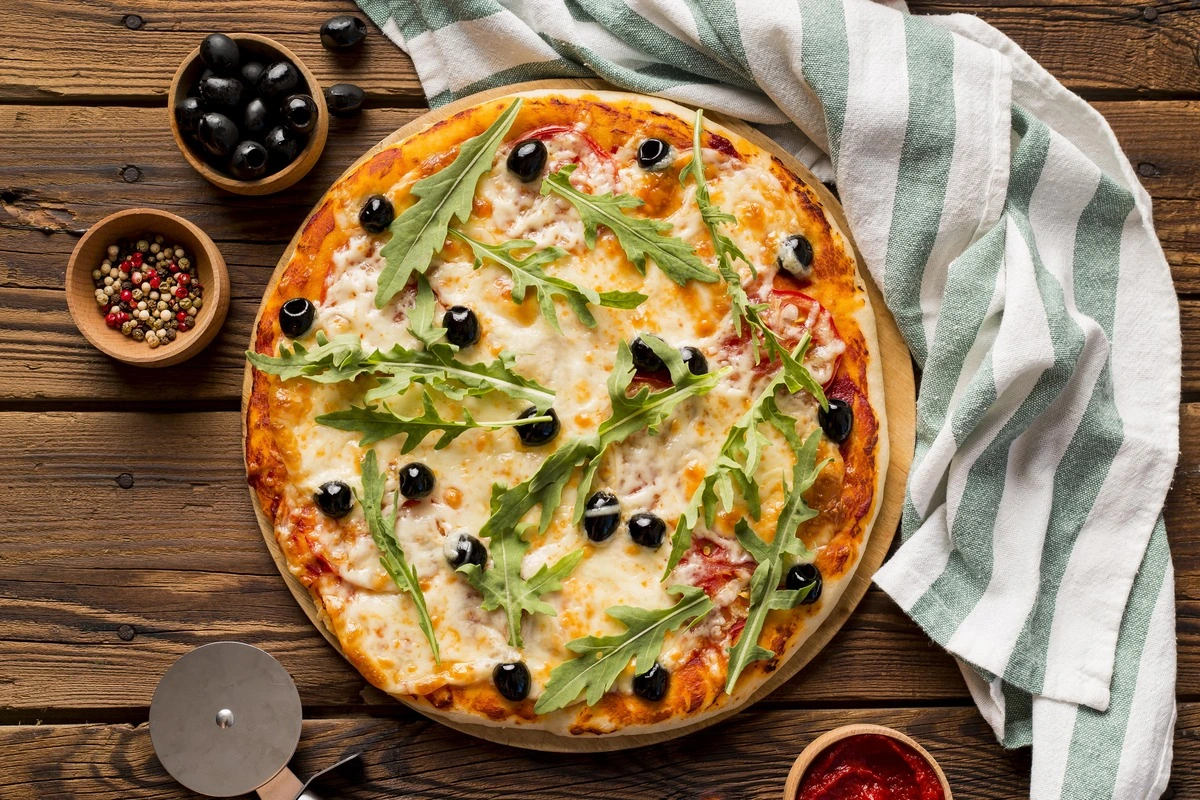 Mini Verse Margarita Pizza on a wooden board with fresh basil