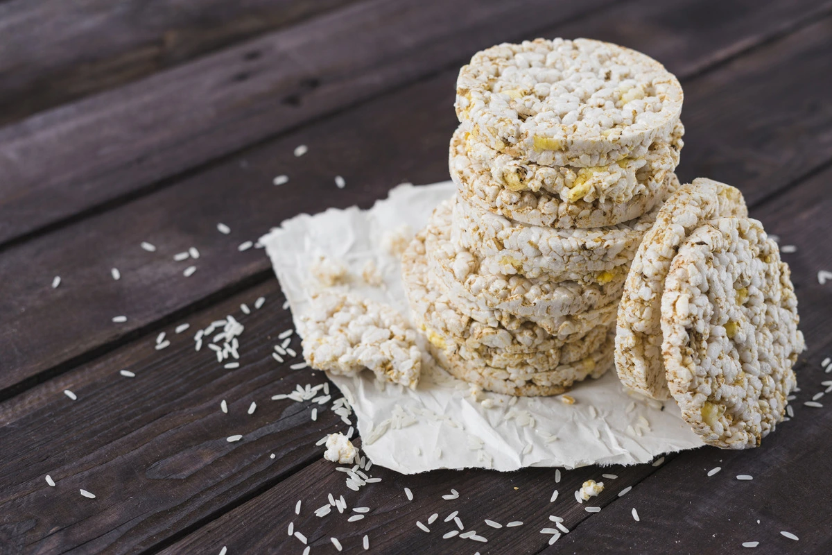 A plate of freshly made rice cakes topped with herbs.