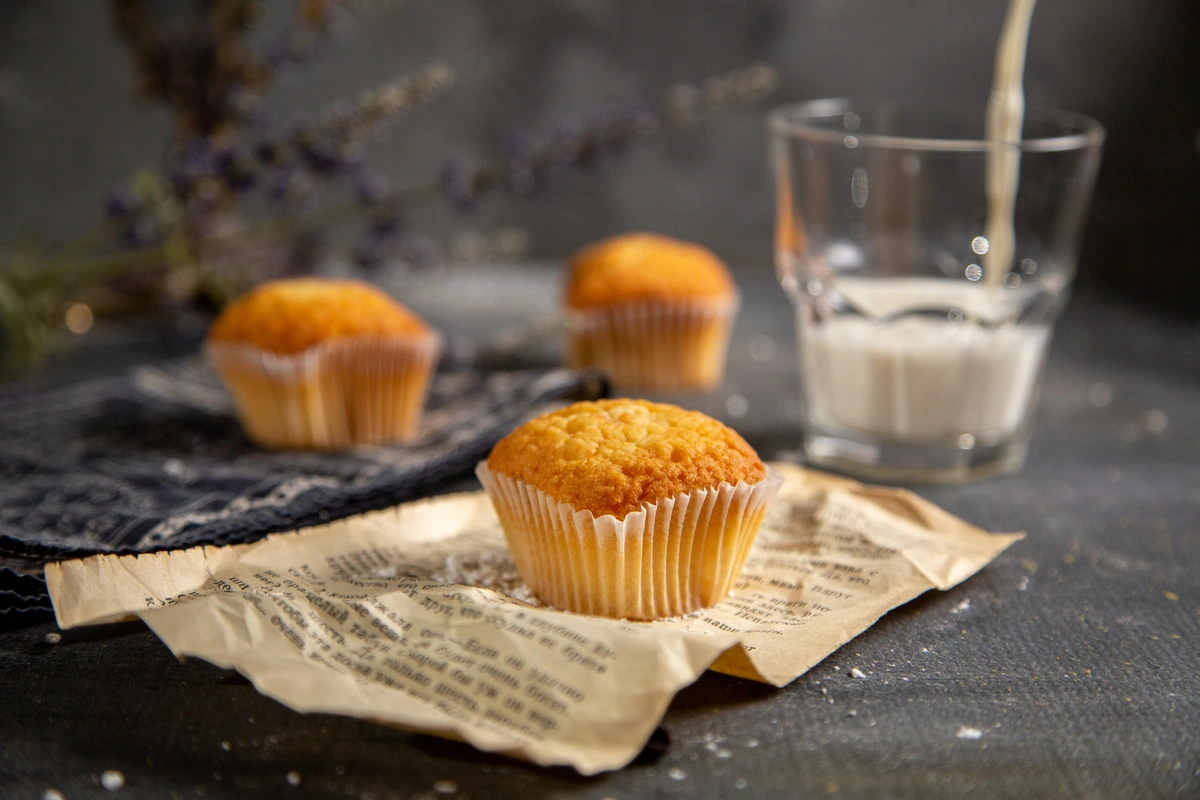 Freshly baked cream cheese zucchini muffins with a golden crust