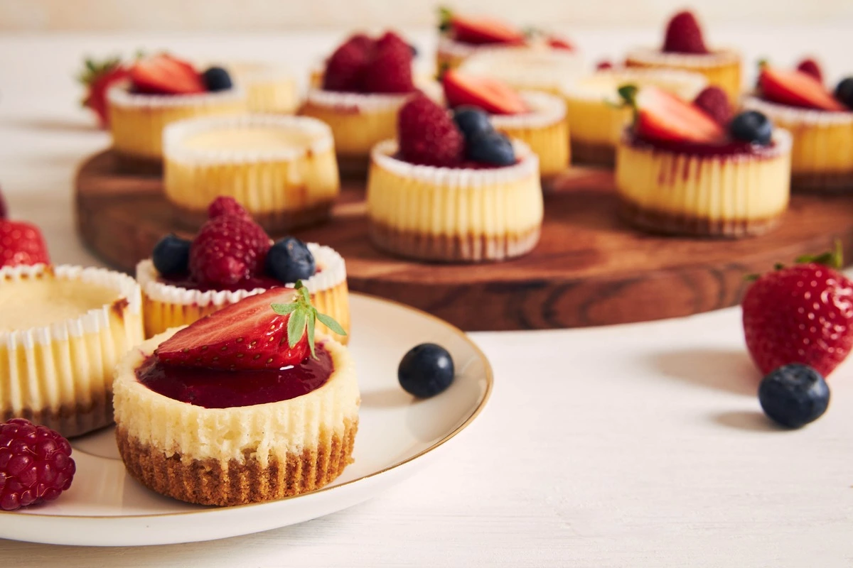 Delicious Mini Cheesecakes with Fresh Berries and Cream