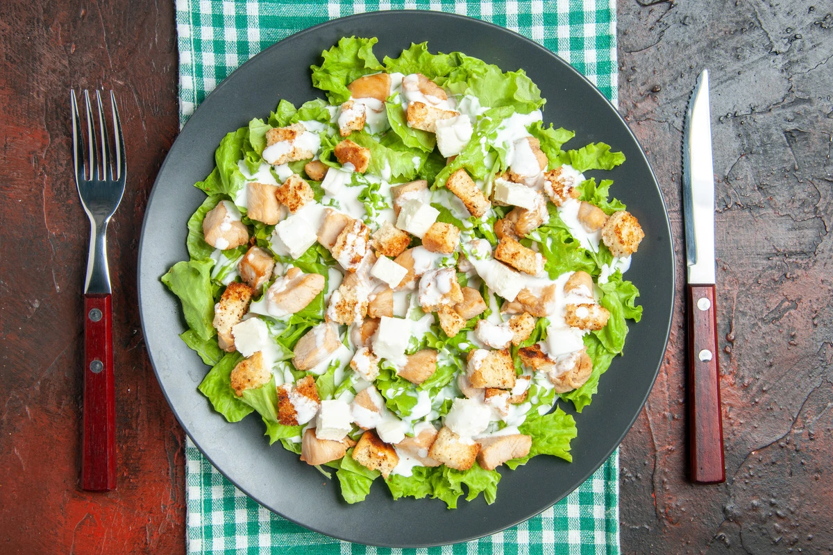 A bowl of fresh Caesar Salad with croutons and Parmesan cheese