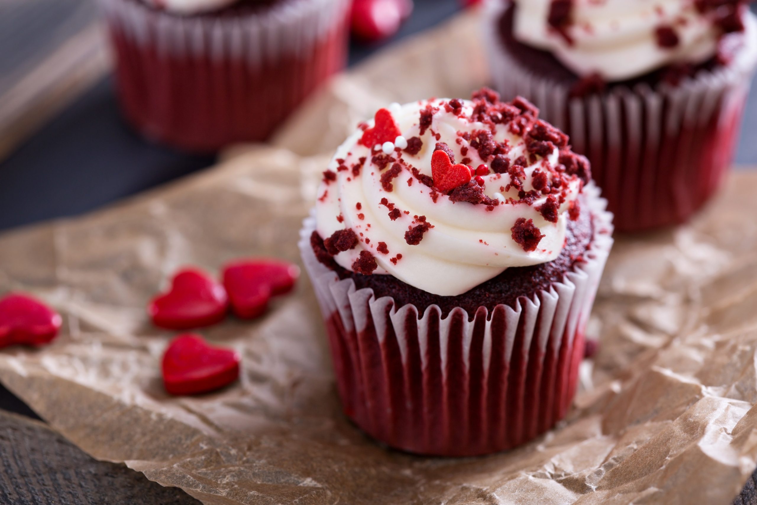 A smooth, creamy Red Velvet Pots de Crème topped with whipped cream and chocolate shavings.